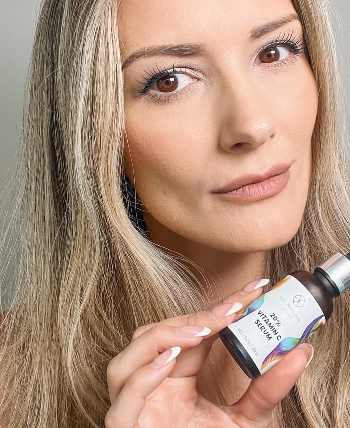 skincare user generated content holding vitamin c serum